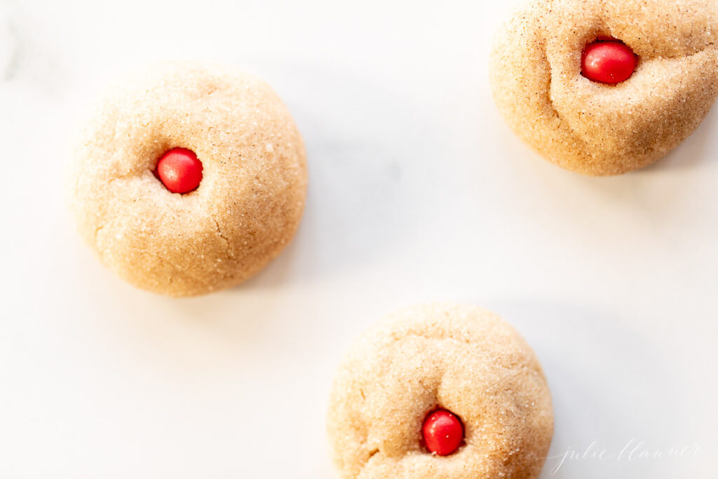 cookies that look like rudolph noses on white surface