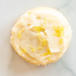 Frosted lemon cookie on a marble surface
