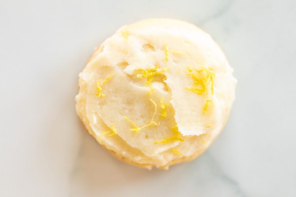 Frosted lemon cookie on a marble surface