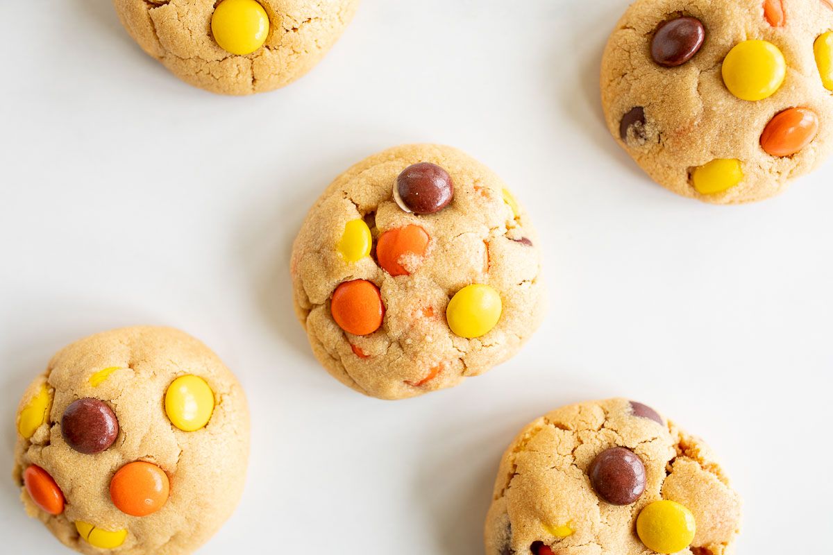 chewy reeses pieces cookies on a white background