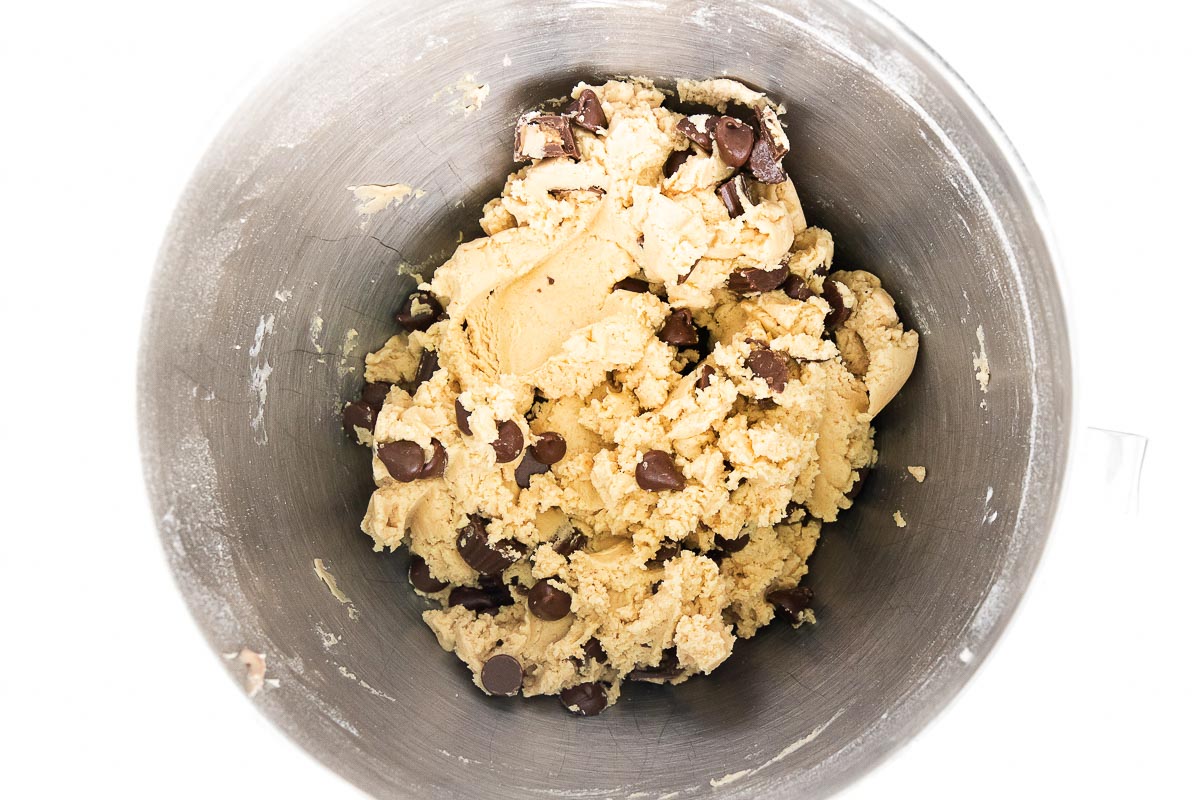 adding chocolate to cookie dough