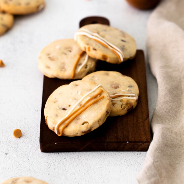 Butterscotch shortbread cookies on a wooden tray.