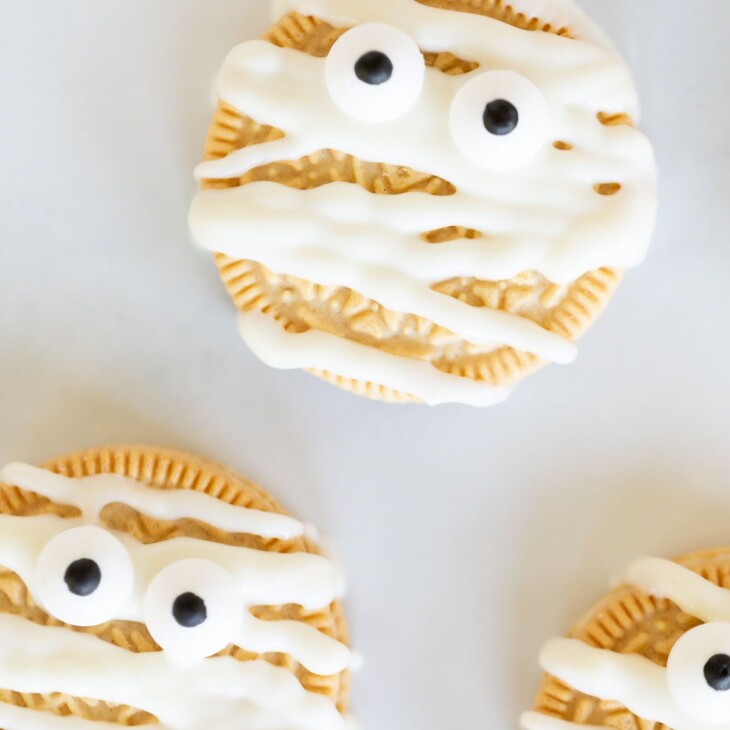 A Halloween oreo decorated as a mummy cookie