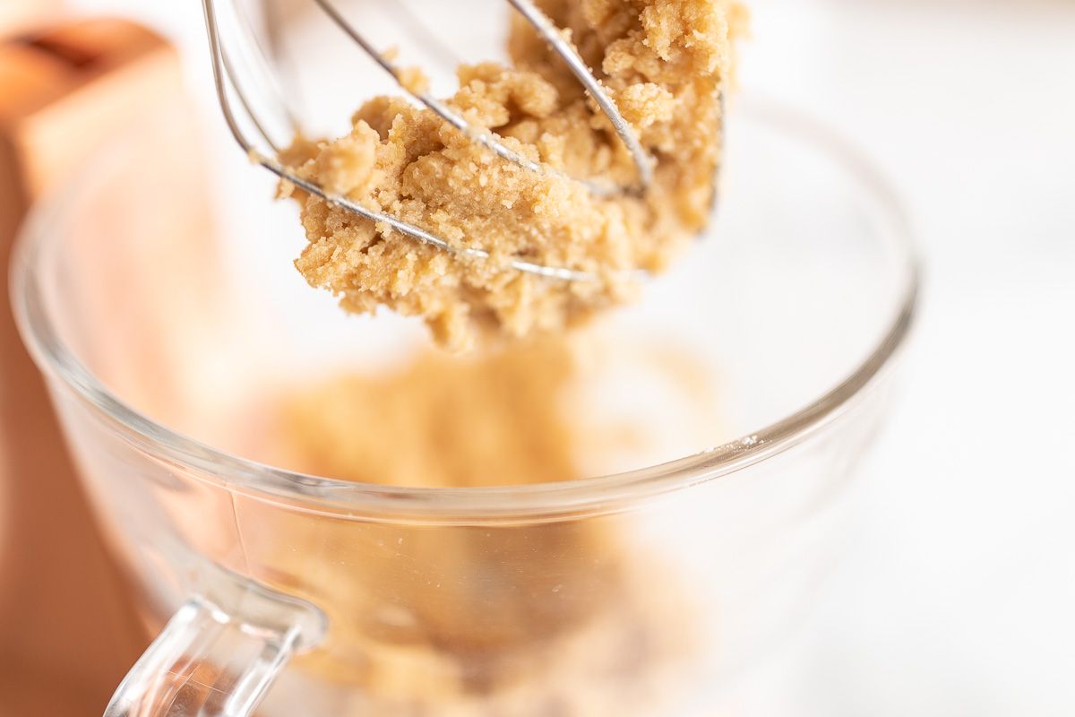 Cookie dough in a glass stand mixer bowl