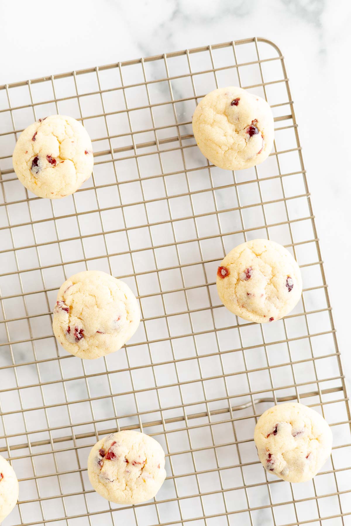 cranberry orange cookies on rack