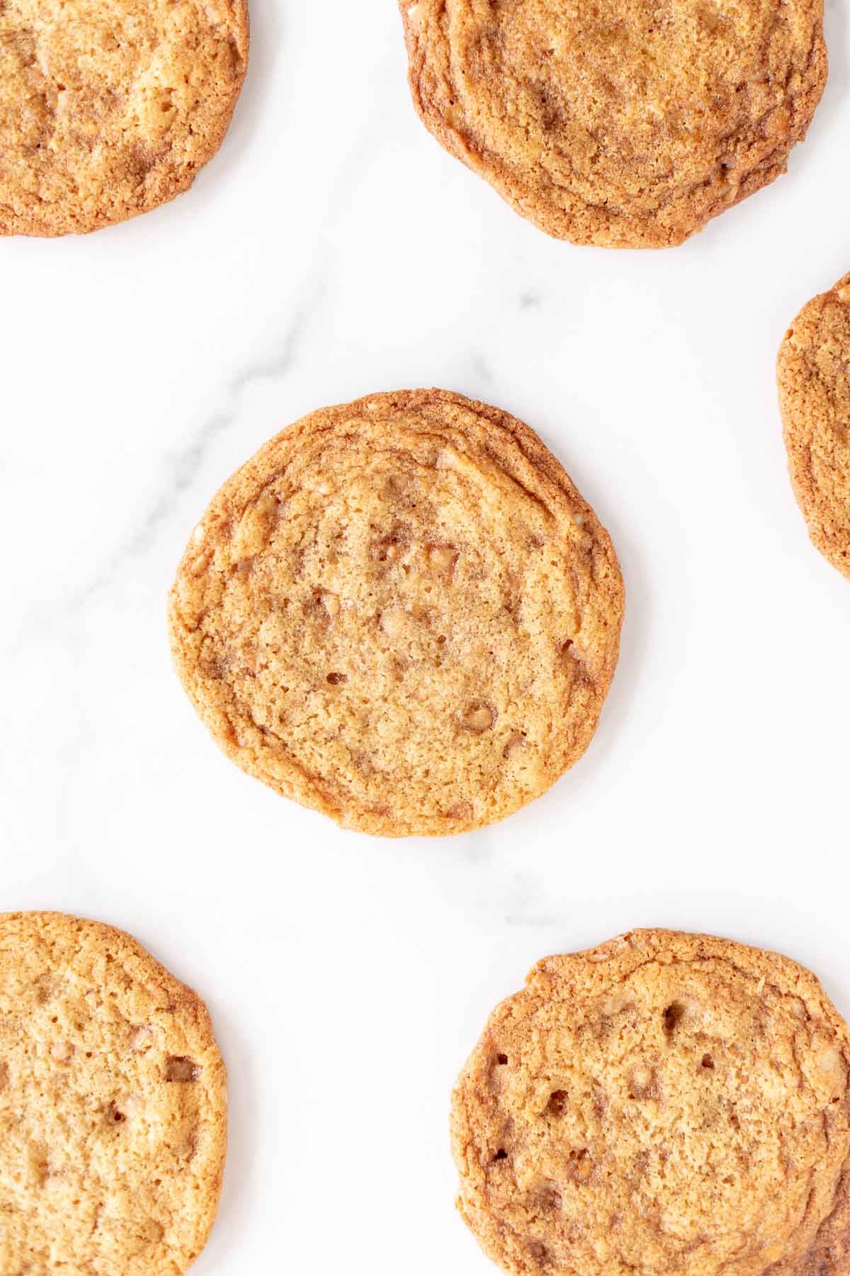 brown butter toffee cookies on a marble surface