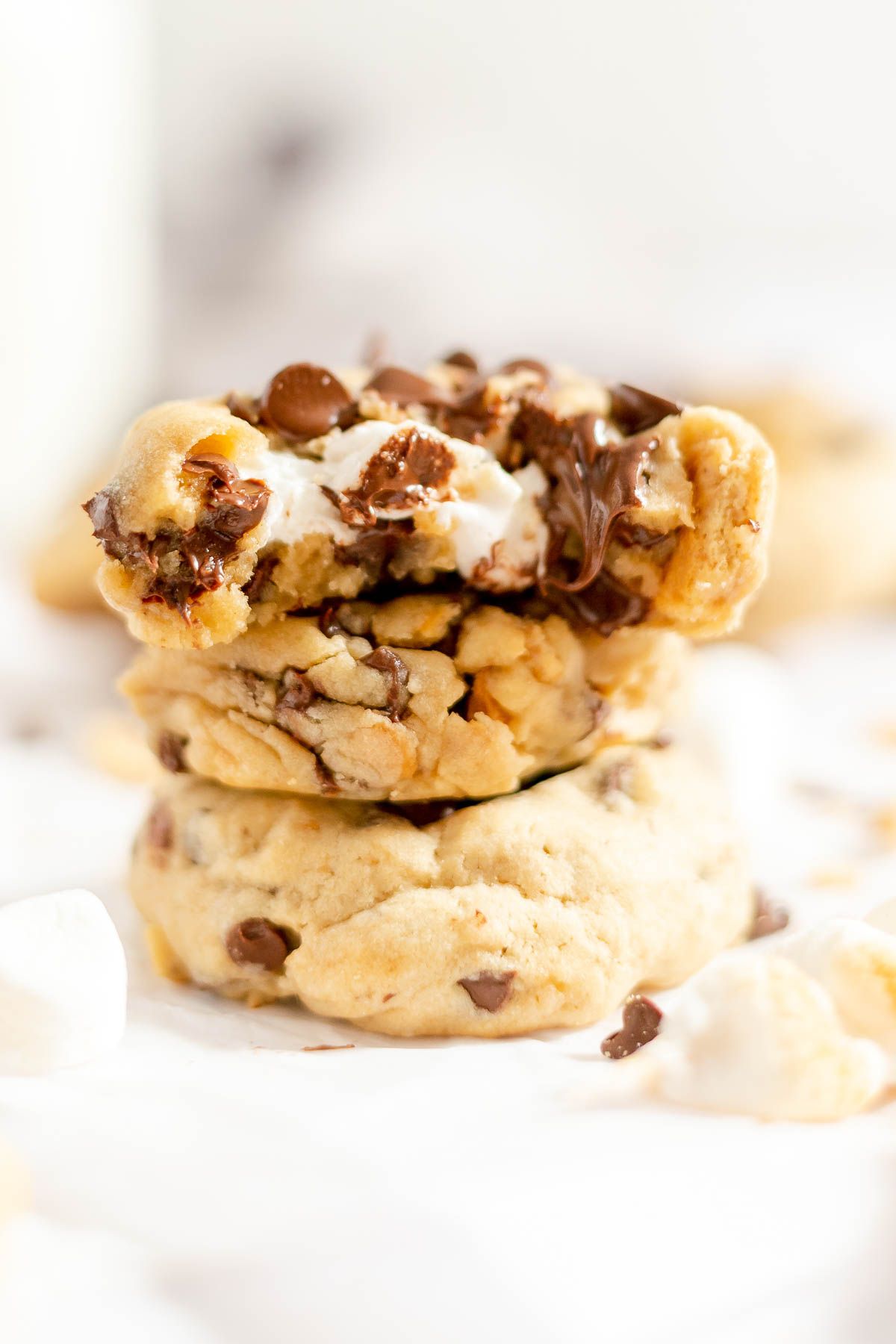 A stack of smores cookies, top one has a bite taken out