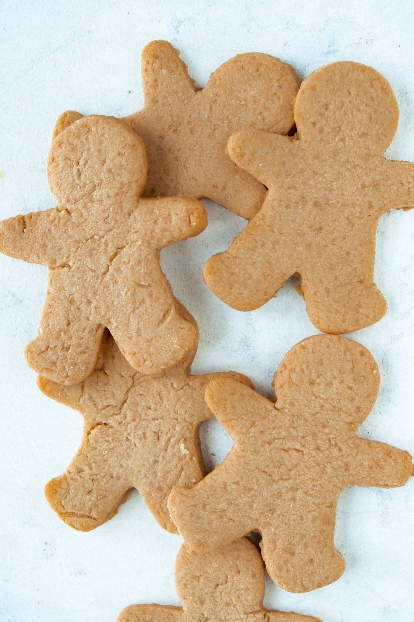 Gingerbread men cookies on a white surface