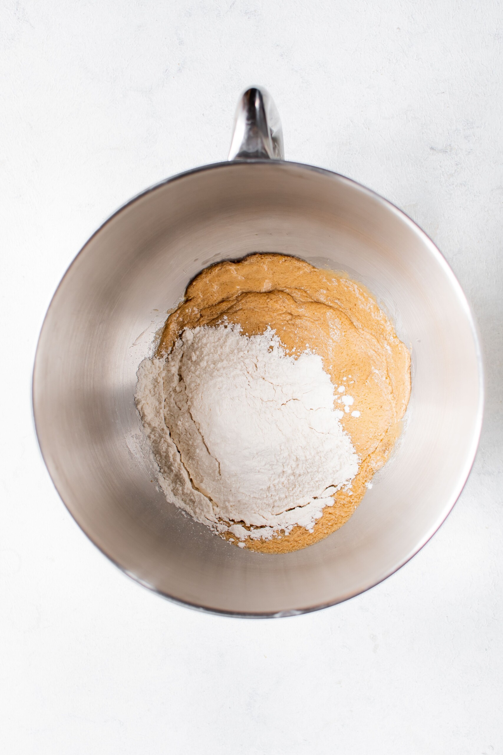 Skeleton cookie dough in a silver mixer bowl