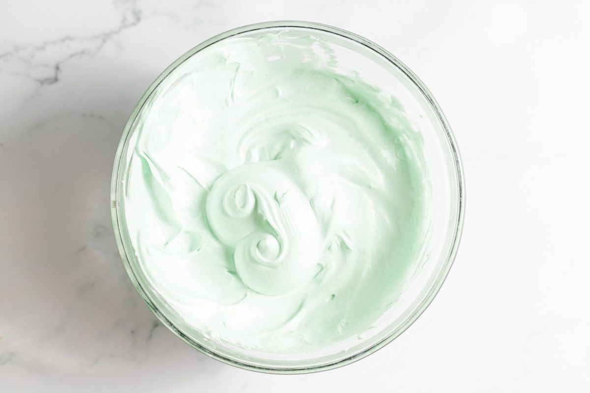 pale green meringue whipped in a bowl.