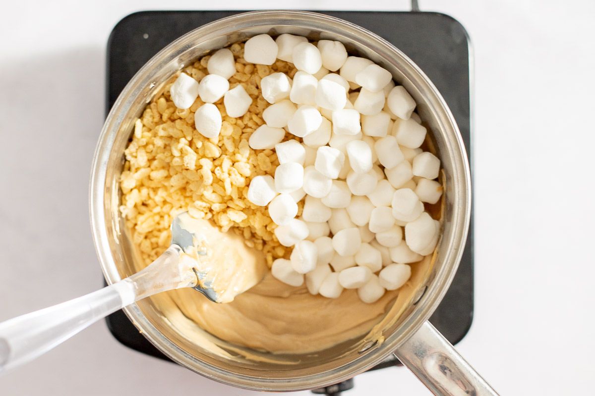 Ingredients for avalanche cookies in a silver pan on a cooktop