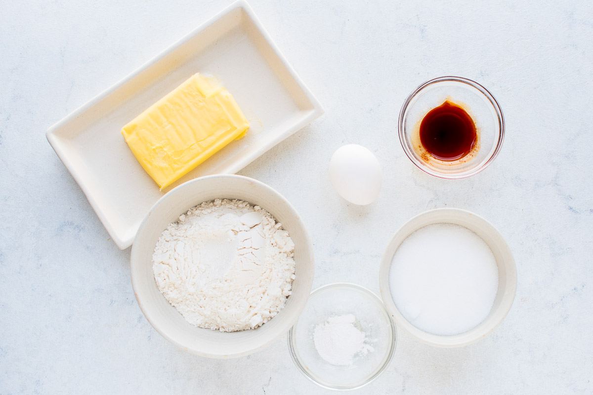 Hot chocolate cookie cup ingredients on a white surface