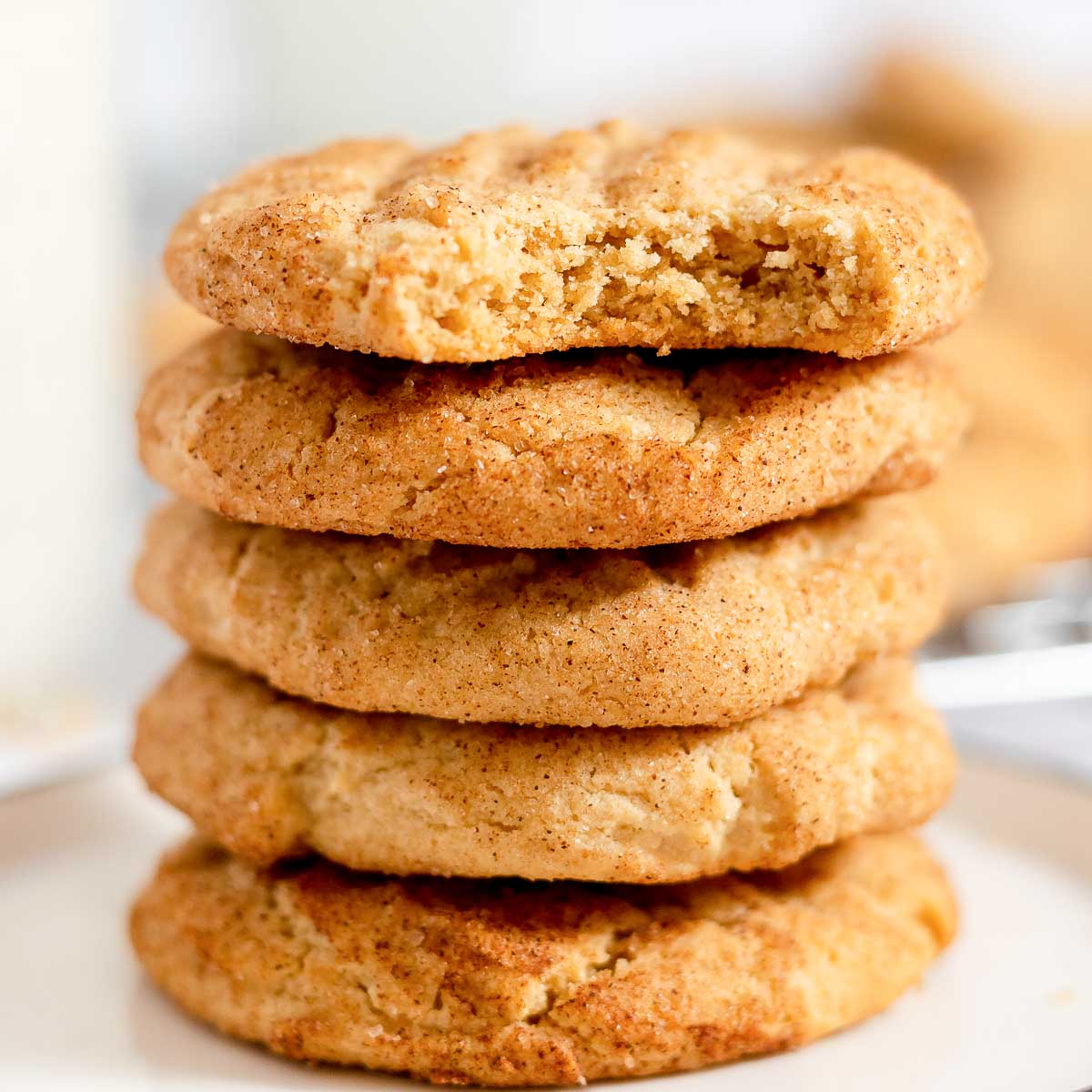 Stack of peanut butter snickerdoodles, with top cookie bitten