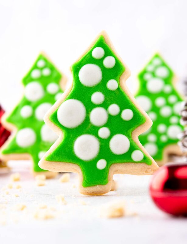 Three standing Christmas tree cut-out cookies