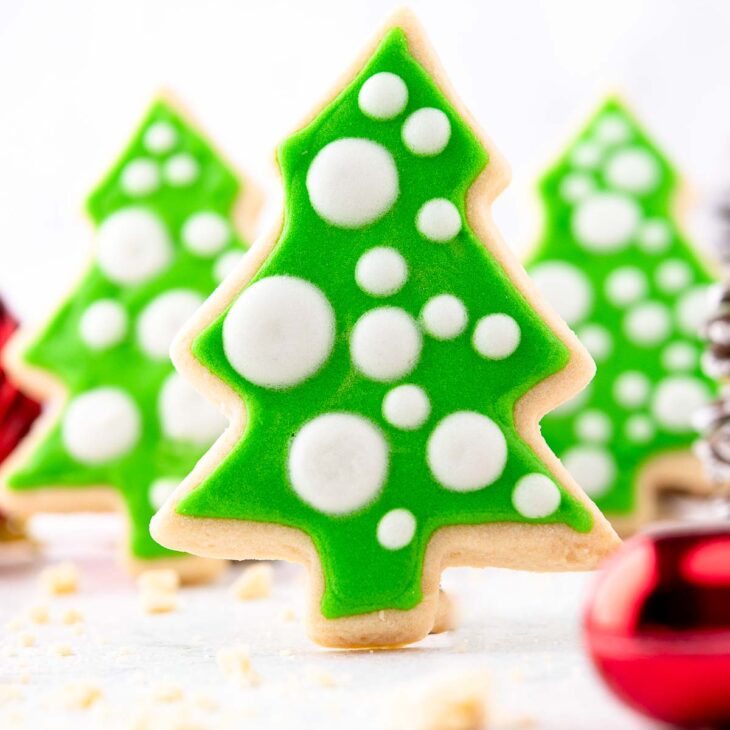 Three standing Christmas tree cut-out cookies