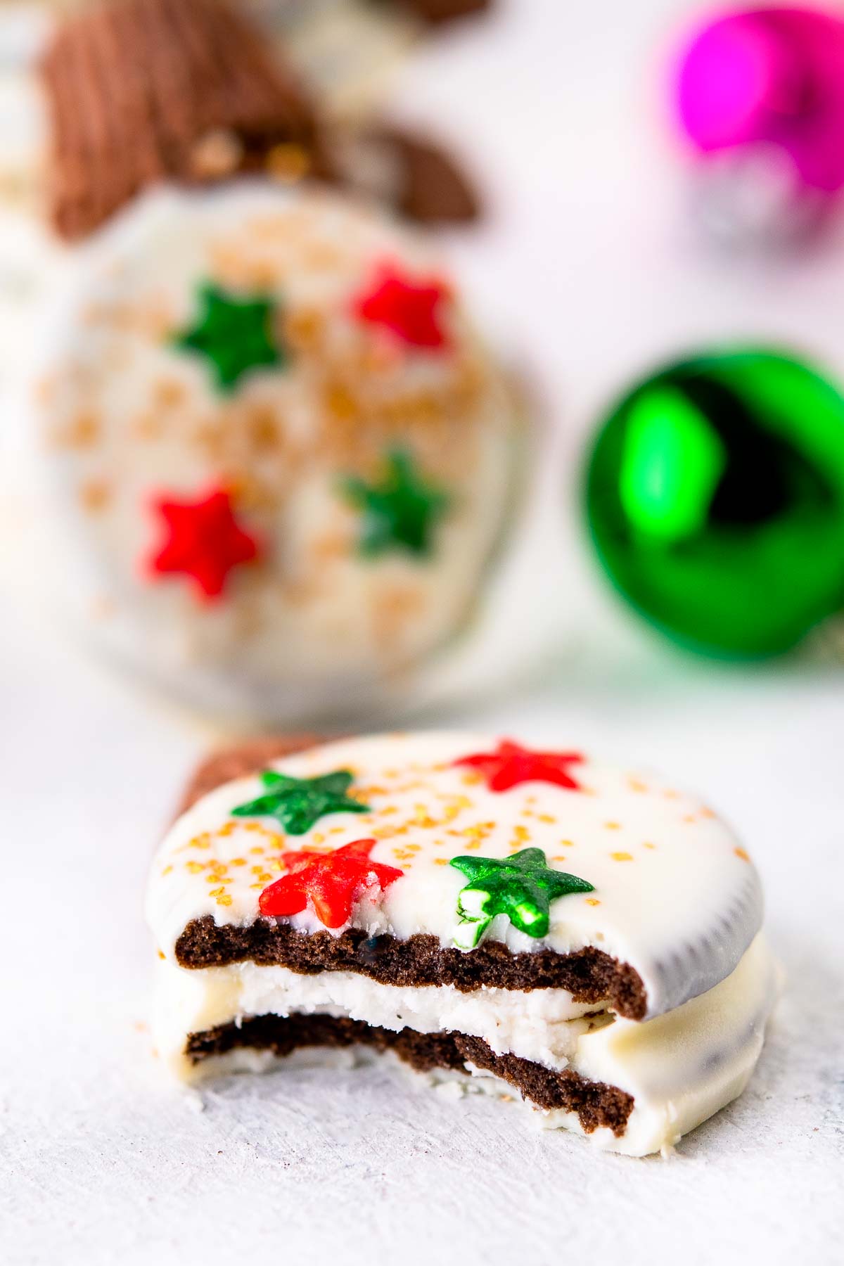 Oreo ornament cookie with bite taken out to show filling