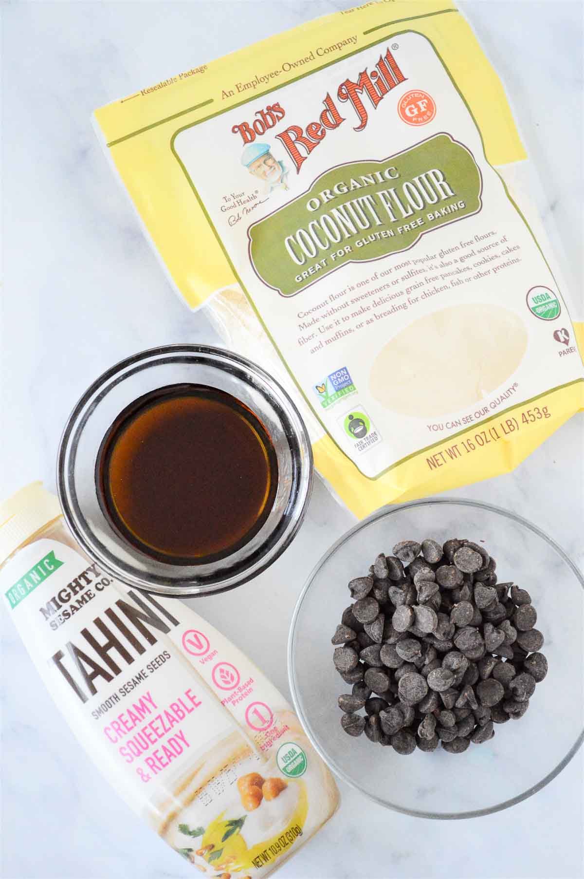 Overhead view of ingredients for tahini chocolate chips energy balls